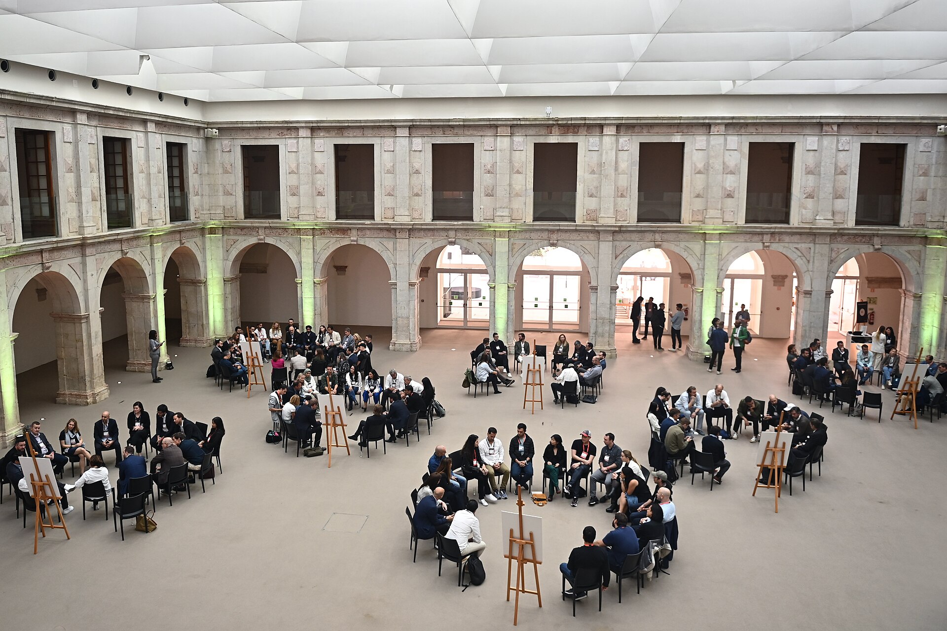 Restored Convento do Beato cloister with participants
